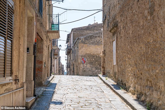 One of the many quaint, sun-kissed streets that run through Mussomeli in Sicily