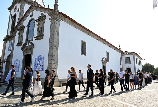 Mourners at the funeral of Diogo Jota and Andre Silva make their way into the Igreja Matriz de Gondomar in the town of Gondoma to start the funeral service