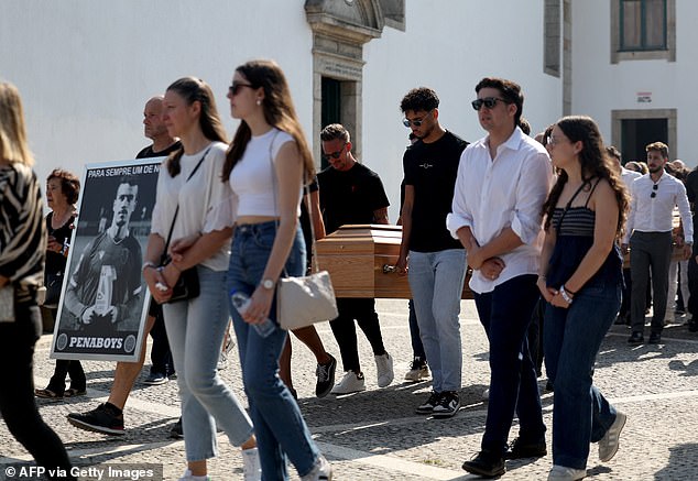 The coffins of Diogo Jota and his brother Andre are carried through the streets of Gondomar during a joint funeral procession