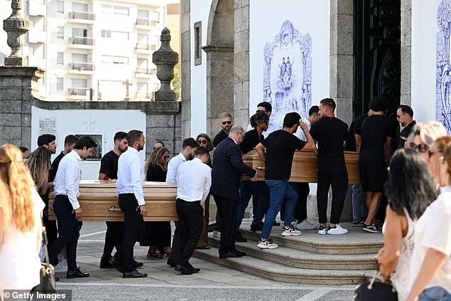 The coffins of Diogo Jota And Andre Silva are carried by family, former teammates and friends into the Igreja Matriz de Gondomar where the funeral is being held