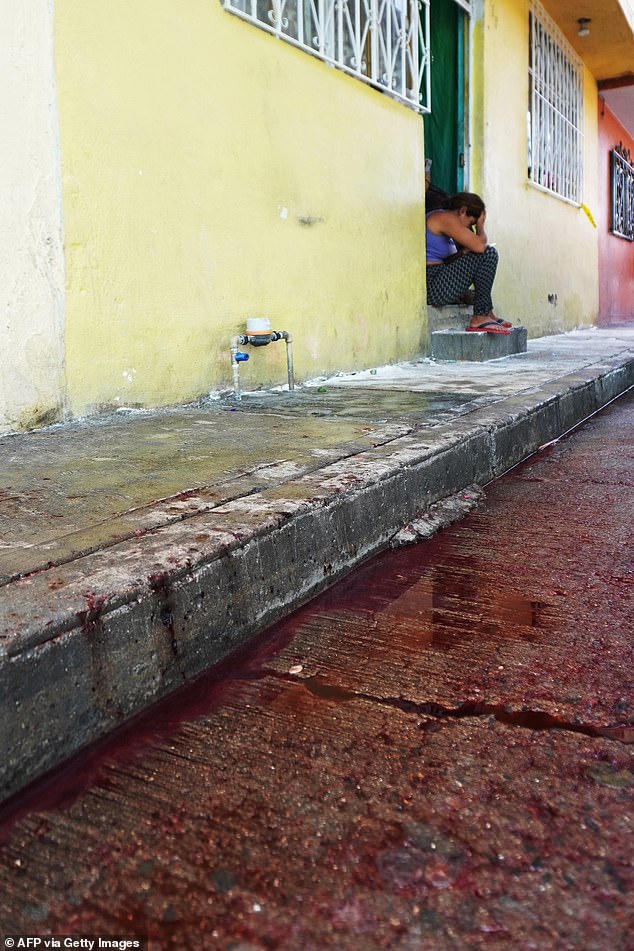 A pool of blood seen at the venue of the religious gathering where gunmen opened fire killing eleven people