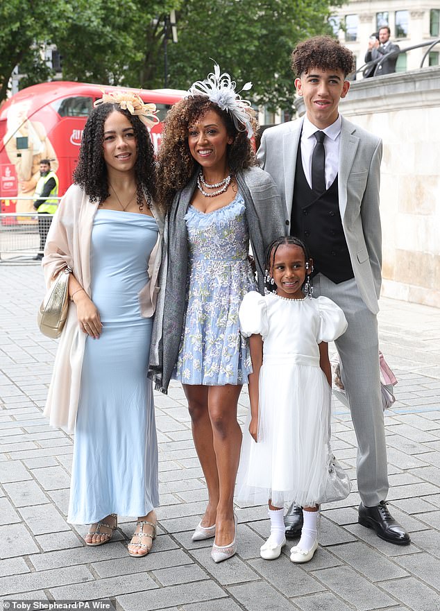 Mel B's sister Danielle Brown looked radiant in a blue floral mini dress as she headed into the cathedral with her children Mimi, Hendrix and Myla