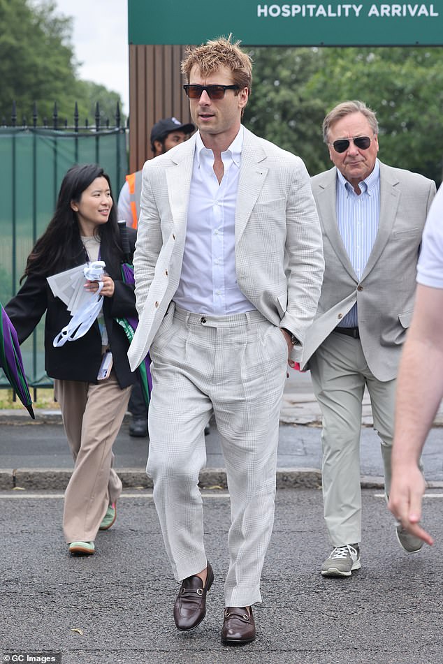 Actor Glen Powell opted for a chequered beige suit which he teamed with a white shirt and brown loafers