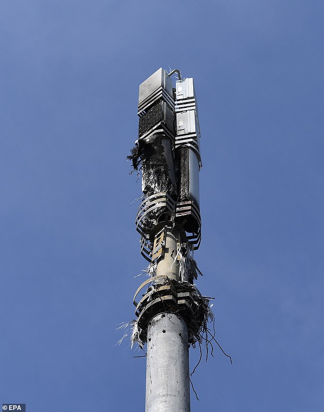 A burned down mast in London during the pandemic that was attacked by conspiracy theorists