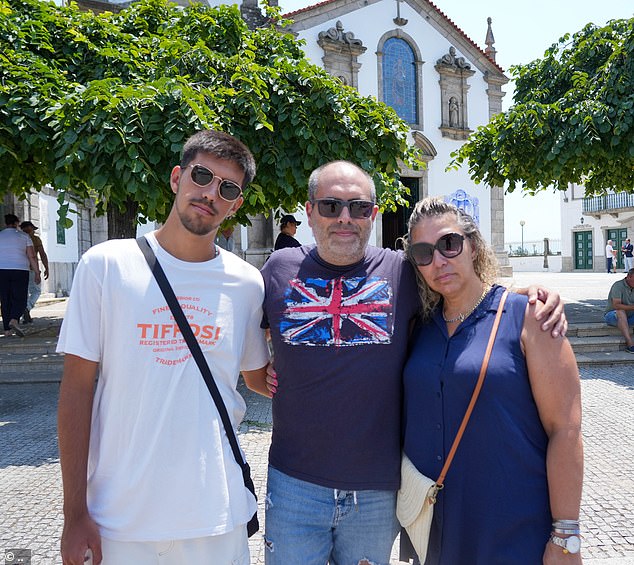 Portugal fan Carla Matos with her son Alfonso and husband Paulo. Carla said her son was 'disappointed' that Ronaldo wasn't at the funeral