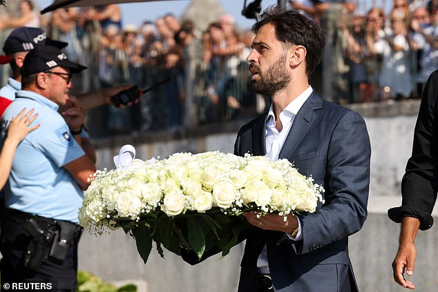 Bernardo Silva carried a floral tribute as he attended the funeral service in Gondomar