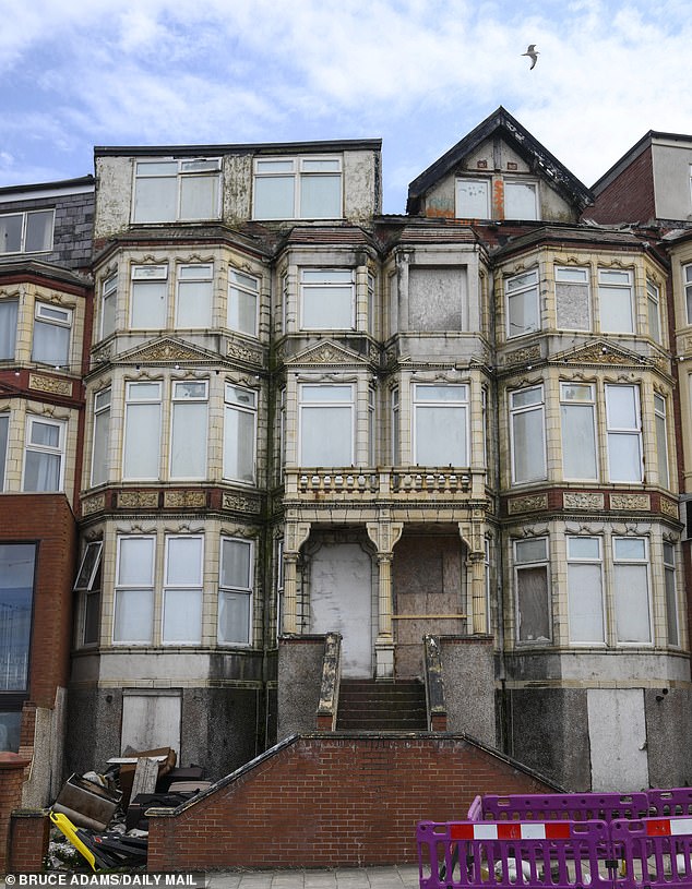Despite its baroque architecture, Sherwood Hotel can be seen decaying, with boarded up windows and a crumbling roof