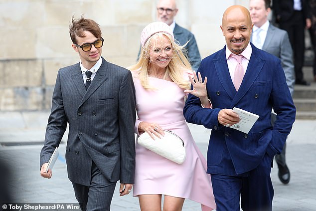 The mum-of-two looked delighted as she arrived at the venue, beaming with smiles as she was accompanied by her husband Jade Jones and Beau