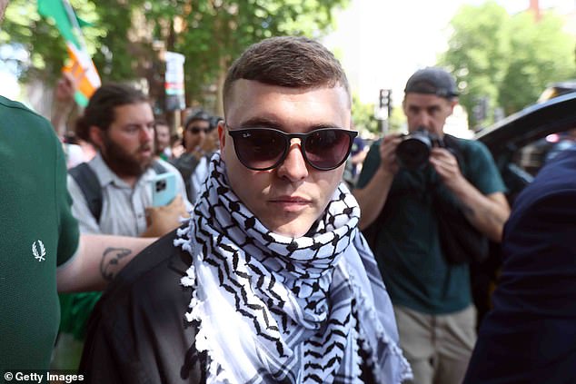 Corrigan recently attended the protest outside the hearing of Kneecap singer Liam O’Hanna
