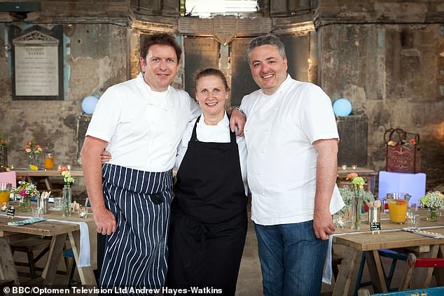 Corrigan (right) poses with his co-hosts James Martin (left) and Angela Hartnett (centre) on the BBC show Great British Budget Menu