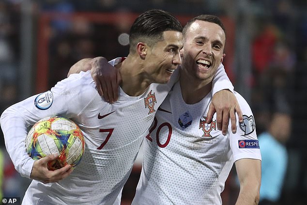 Portugal captain Cristiano Ronaldo, pictured (left) with Jota in 2019, did not attend the service