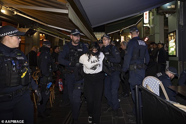 Protesters gathered outside Israeli restaurant Miznon on nearby Hardware Lane