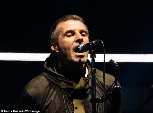 Liam (above) returned only when he was needed on vocals, and Noel would often turn his back to the audience and slink into the background