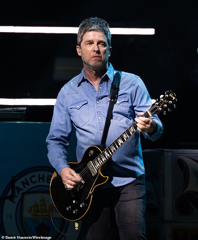 The singers did not always appear in unity, often occupying different sides of the stage. When Noel (above) played his solo songs such as Don't Look Back in Anger and Masterplan, Liam left the stage and walked past his brother without looking at him