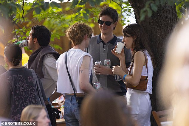 Meanwhile Ben cut a smart figure in a smart striped polo shirt with sunglasses as they enjoyed some drinks in the show