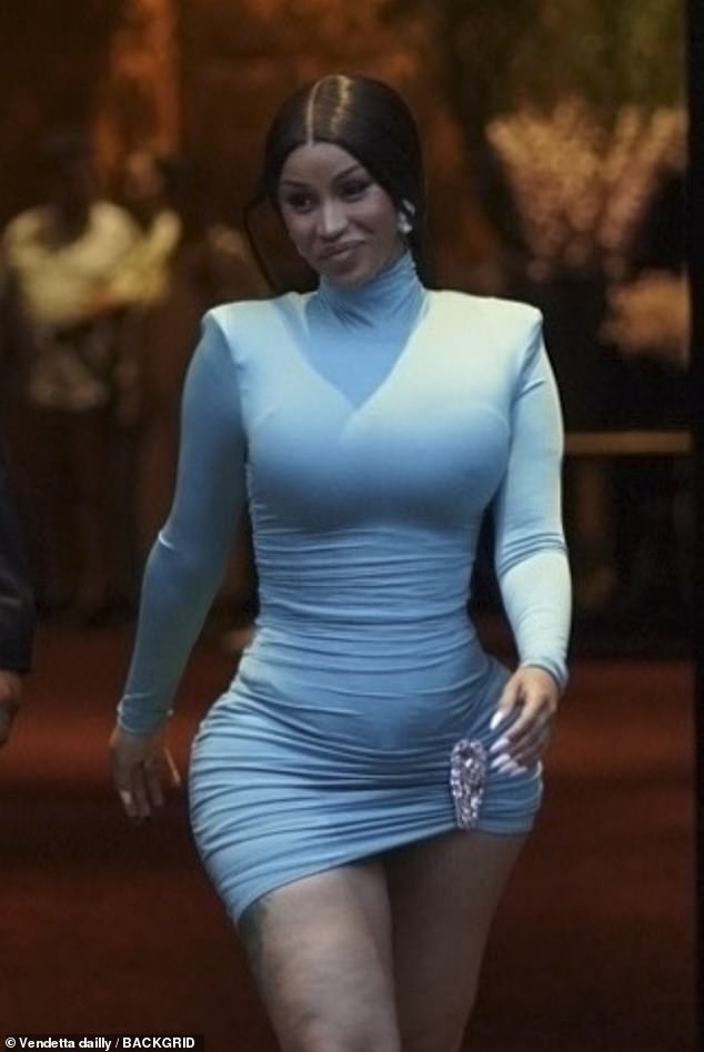 The WAP singer wore a mini dress with a turtleneck and long sleeves in a brilliant shade of blue
