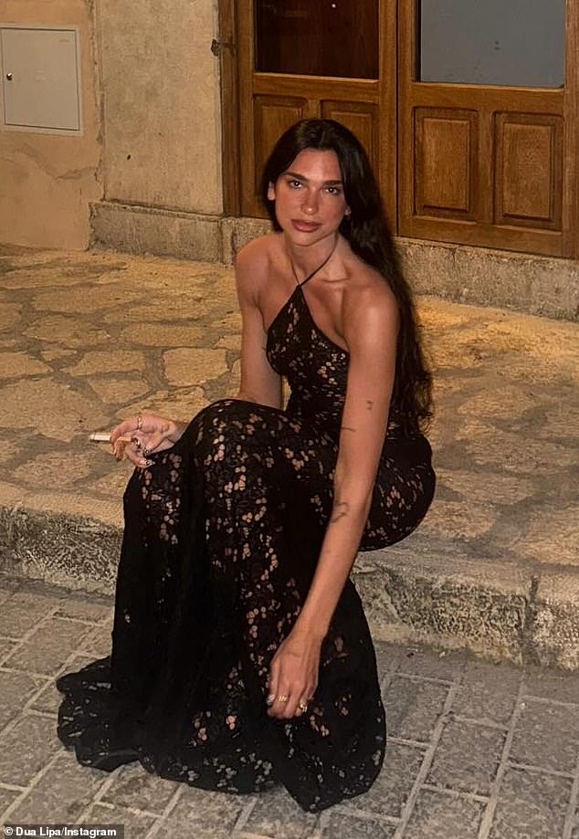 Dua made a bold statement in a black lace maxi dress that hugged her jaw-dropping figure