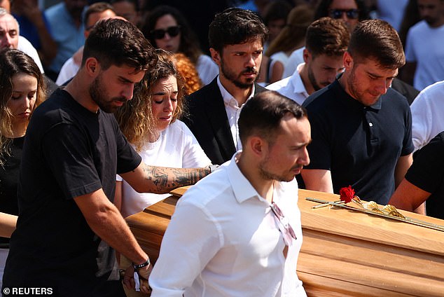 Rute Cardoso helped as pallbearers carry a coffin, at the funeral ceremony of her late husband Liverpool's Portuguese soccer player Jota and his brother Andre