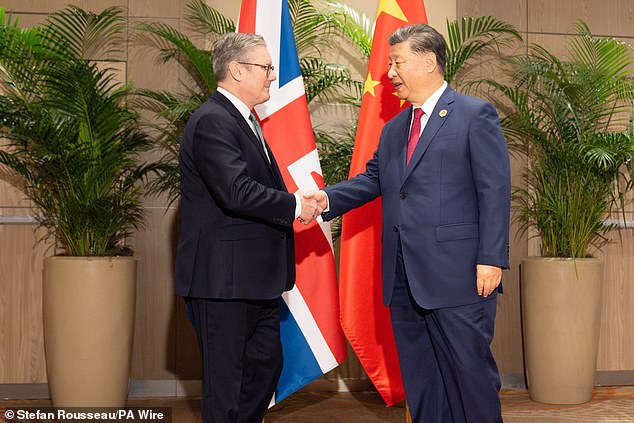 Shadow Levelling Up Secretary Kevin Hollinrake accused Sir Keir Starmer of attempting to 'woo the Chinese Communist Party to bail out their failing economic policies' (Sir Keir pictured with President Xi Jinping)