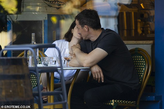 The couple, who have been together for two years, were seen holding hands and kissing during the meal