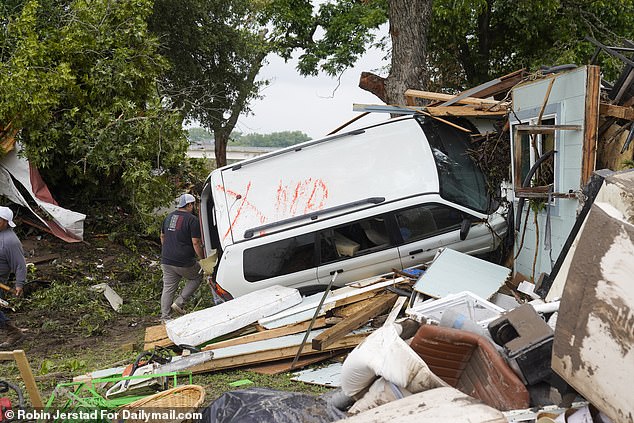 A car was slammed into a home during the Guadalupe River flood