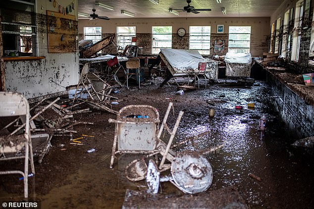 As of Saturday afternoon, the death toll has risen to 50, with 27 children from a summer camp situated along the river - Camp Mystic - still missing. Pictured: Furnitures lie scattered inside a cabin at Camp Mystic after deadly flooding