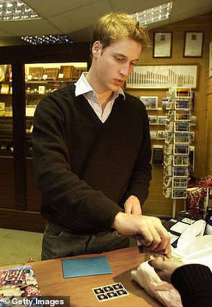 William pays for stamps in the Good News newsagents in St Andrews on December 12, 2003