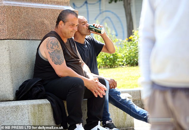 Two men drink lager in the sun in Rawson Square where local workers have moaned about anti-social behaviour