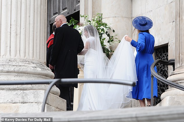 She was seen being helped up the steps to the cathedral