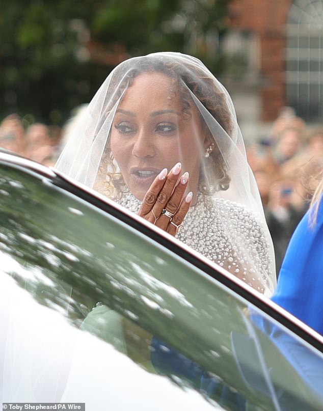 Mel showed off her manicured nails and silver and pearl jewellery as she climbed out of the car