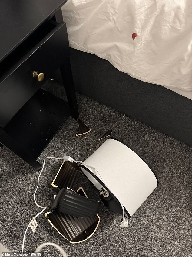 A lamp sits smashed on the floor at the £450-a-night rental which is owned by company director Matt Genesis