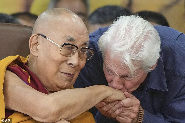 He was seen reverently kissing the spiritual leader's hand at the event, held at Dharamshala - headquarters of the Tibetan government-in-exile