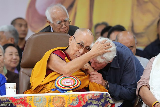 On Sunday, Gere was among red-robed monks as they chanted at the Himalayan hilltop forested temples in India, home to the Dalai Lama