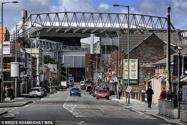 Anfield Stadium can be seen standing over Oakfield Road, which was once full of shops