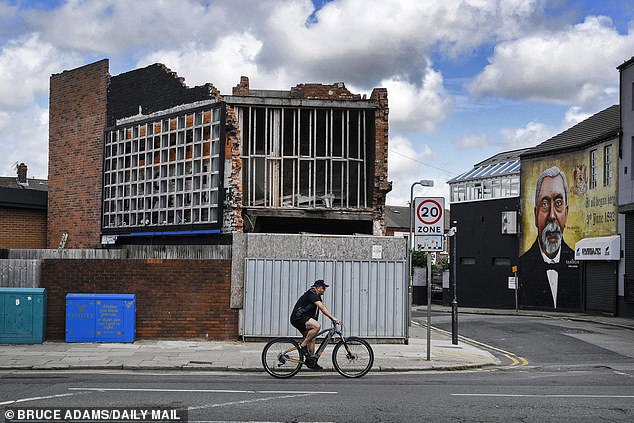 A broken building that is disintegrating just metres from Anfield Stadium