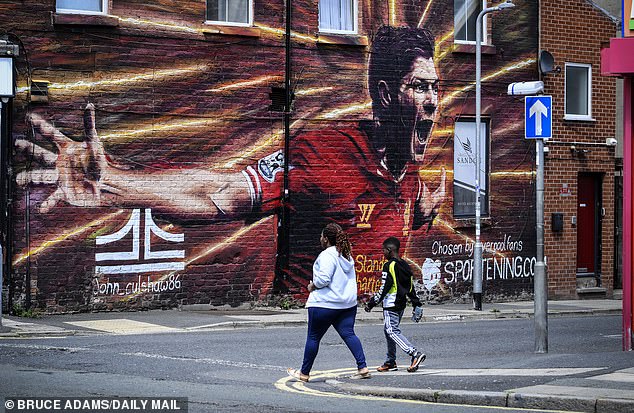 A mural of Steven Gerrard painted on a side street near Anfield Stadium