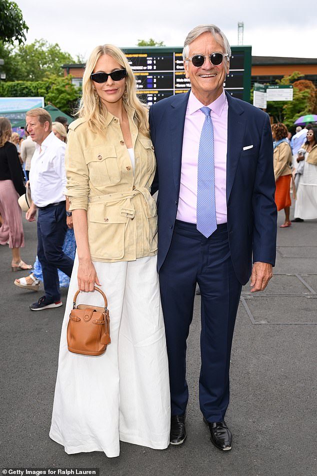 She accessorised with dark shades and wore her blonde tresses in loose waves as she posed with her father who wore a dapper navy suit