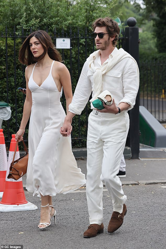 They sweetly held hands as they arrived