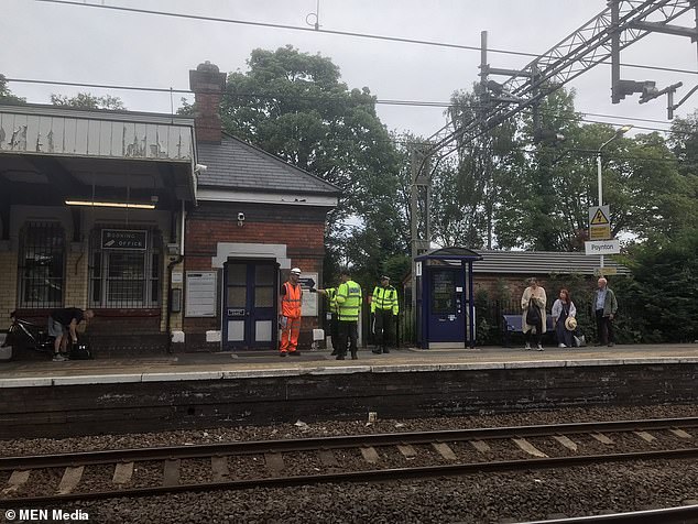 Pictured: British Transport Police at Poynton station in Cheshire after two teenagers were found dead on Thursday