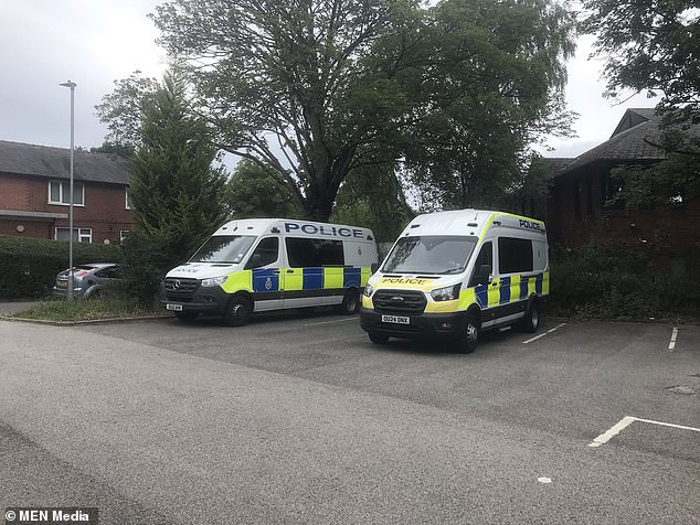 Pictured: Police vans parked at Poynton station in Cheshire after the tragedy