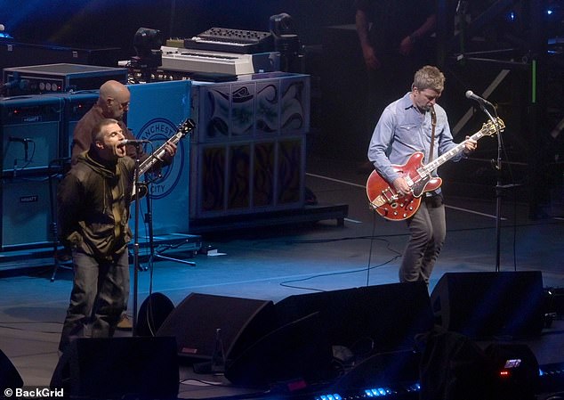 Liam Gallagher (left) and brother Noel (right) performed hits such as Whatever and Wonderwall