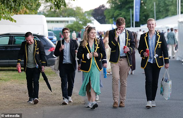 A group of people wearing boating jackets enjoying the festivities as the fifth day of the Henley Regatta came to a close