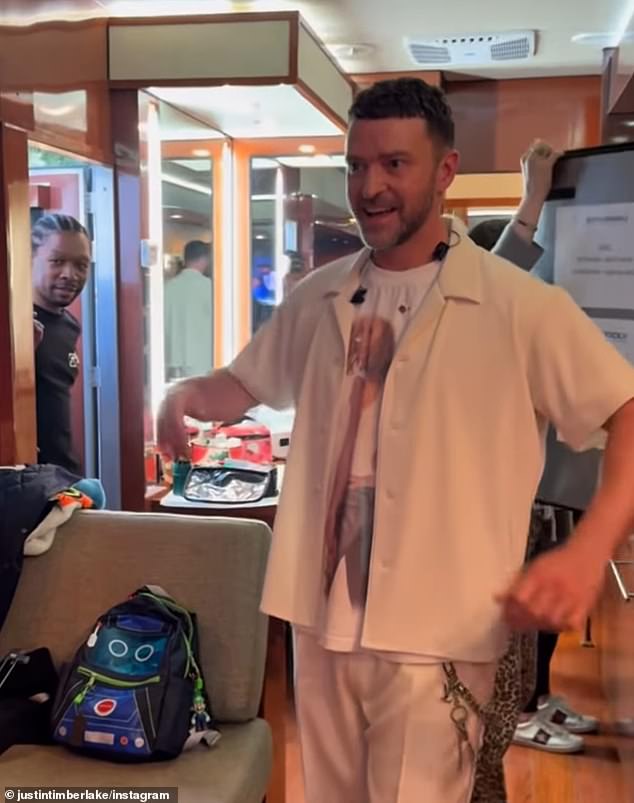 Then, Timberlake opened his button-down dramatically with a 'bam' to show her what he was wearing