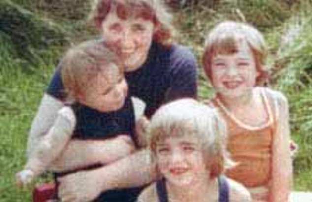 In another photo their mother Peggy posed with her three sons as children