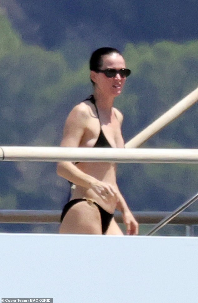 Katy's perky bust was on display in a revealing triangle top, and she bared her washboard abs in the swimsuit's matching bottoms