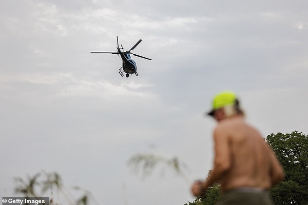 Trump said first responders have helped save about 850 lives so far, although victims feel this response is no match for the destruction (pictured: a helicopter searching for victims)