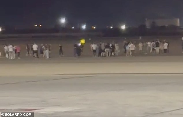 Passengers rushed to evacuate the plane, with six needing to be taken to hospital for treatment