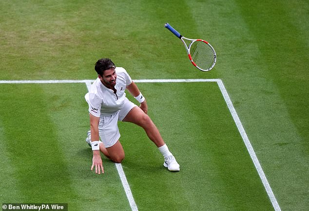A delighted Norrie tossed away his racquet after overcoming Chilean Jarry in a five-set epic