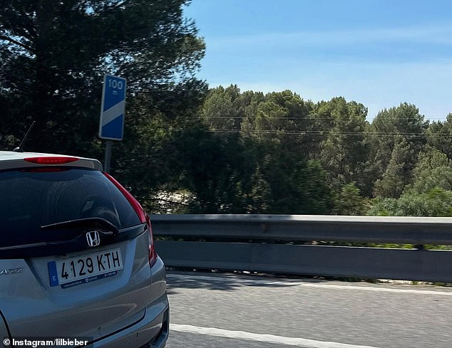 The fifth photo was a shot from a highway. A Honda CRV with European license plates and a speed limit sign indication 100 kilometers per mile, which is 62 miles per hour