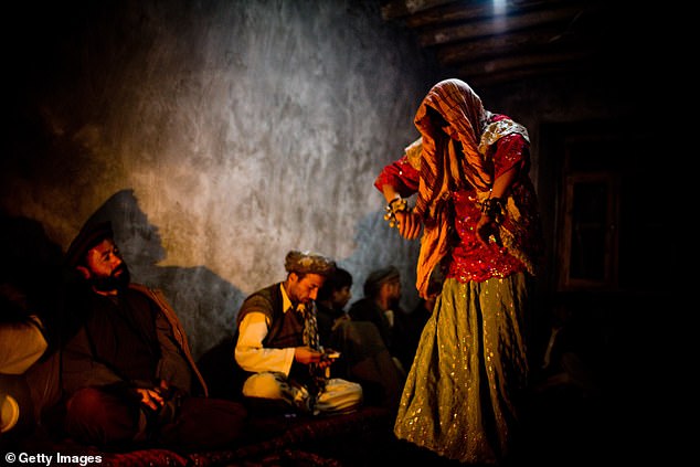 A young Afghan Batcha Bazi (Dancing Boy) performs a dance in a private party on November 22, 2008 in a small city in the north of Afghanistan